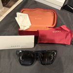 Gucci GG1714S cat-eye sunglasses with a black frame and solid grey lenses Photo 3
