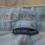 American Eagle  Outfitters next level stretch hi-rise jegging denim jeans in light wash blue size 4 short. Photo 4