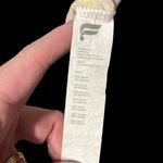 Fabletics  flourescent yellow and purple swirls on a cream tee. NWOT. Photo 5