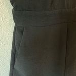 Line and Dot  Cutout Open Back Ruffle Barre Sleeveless V-Neck Black Romper Photo 6