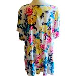 Torrid NWT- Stunning white with bright colorful flowers, babydoll style, ties in front, flutter sleeves, lightweight, the perfect summer top, brand new, size 2x Measurements: Bust: armpit to armpit 25 inches Waist: side to side 22-27 inches Length: shoulder seam to bottom 30 inches Photo 5