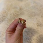 Yellow gold cherubs angels stud earrings holding amethyst birthstone Photo 1