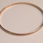 5 FOR $25 Set of 4 gold arrow bangles. Photo 3