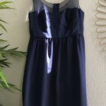 American Eagle 90s Outfitters navy blue dress with mesh overlay and a pleated bodice. Photo 1