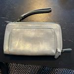 Joy Susan silver wristlet purse with credit card inserts and pocket. GUC. Photo 0