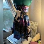 “Strapless dress with an abstract print in shades of blue, purple, and black. Blue Size 4 Photo 2