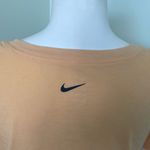 Nike  Women’s Dri-FIT Script-Logo Orange Scoop Neck Training T-Shirt Medium Photo 3