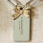 Coach  Gold Bow and Silver Hangtag Necklace Photo 3