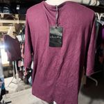 A Love Story Purple Burgundy Tunic Top Stretch Knit V-neck Dolman 3/4 Sleeve NWT Pit to pit about to 30” inches  Super stretchy soft knit light sweater top  Color: WINE HEATHER New with tag  Ships same business day if payment is received prior to 1pm EST! Smoke and pets free & temperature controlled facility Thanks for shopping my store Photo 2
