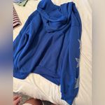 Blue Hoodie with Star Accents Photo 1