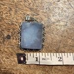 None sterling silver pendant with a rectangular moonstone ornate bezel setting. Photo 3