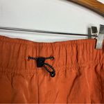 Nike loose fit high rise cargo shorts orange rust women’s size small new casual Photo 6