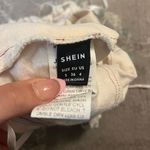SheIn Zip-Up Distressed Jean Tube Top Photo 2