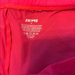 SKIMS  Vibrant Coral Colored Thin Bike Shorts Photo 1