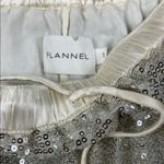 Flannel America Silver Sequin Pleated Skirt
Sz: 1 Size undefined Photo 1