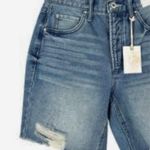 Womens Relaxed Faded Bermuda Denim Short Size 31” NWT Fabric type 100% Cotton Care instructions Machine Wash Origin Imported This product is a pair of Jessica Simpson women's relaxed fit Bermuda denim shorts in size 31". The shorts are faded to give them a casual and trendy look. Made from cotton denim fabric, they are designed in a cut-off style, making them perfect for a day at the beach or a casual outing. The classic blue color adds a versatile touch to your wardrobe, while the relaxed fit ensures comfortable wear. Photo 1