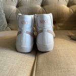 Nike  blazer sneakers girls size 5.5. Only wore once minor, flaw besides that in perfect condition. Color:light pink/white  Photo 8