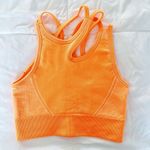 Amazon Ultra Seamless Asymmetrical Neon Orange Sports Bra Photo 0