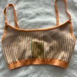 Fabletics orange and grey sports bra. Size medium Photo 0