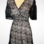 Style & Co . Flirty short black lace dress with full nude lining Photo 0