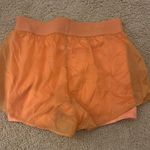 Orange Shorts with Built in shorts and flowy layer Size M Photo 0