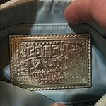 Coach  Poppy Woodmark Multicolor Text Wristlet with Teal Accents. Photo 9