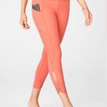 Fabletics Oasis PureLuxe High-Waisted Twist 7/8 Legging- Coral Haze Photo 0