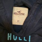 Hollister Women's Navy Hoodie with Teal Logo Photo 1