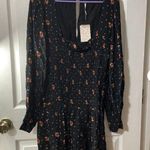Free People NWT Smocked Floral Celestial Star Black LongSleeve Skater Mini Dress Photo 2