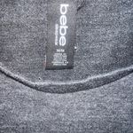 Bebe crop top
Black long sleeve shirt with with logo on front
Size medium Photo 2