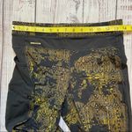 Lole  Burst Black and Gold Print Ankle Leggings. Size Small. EUC Photo 10