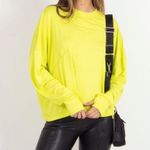 Free people Movement tempo long sleeve oversized tee in size
Medium Yellow Photo 1