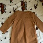 OshKosh Stylish tan pea coat with double-breasted buttons. Features a charming bow accent. Perfect for keeping warm. Photo 2