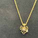 Nina Ricci gold and crystal bow necklace Photo 0