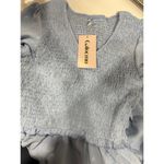 Ruffle Short Sleeve V Photo 2