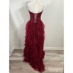 Prom Bay size 6 prom dress in the color wine. Corset with Lace up back & Ruffles Red Photo 3