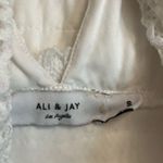 Ali & Jay  Kiss Me in the Candlelight Crochet Tassel Mini Dress in White Photo 3
