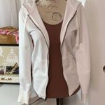 Adidas hoodie. White with rose gold lettering. Full zip. Pockets. Photo 1