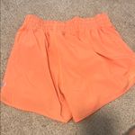 Lululemon  orange hotty hot shorts Photo 6