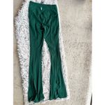 NWOT Free people movement Deep Green Activewear Pants flare leg with slit size L Size L Photo 1