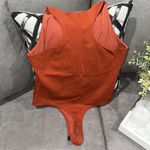 Bebe Orange bodysuit size L Photo 2