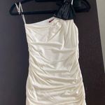 Women size S small One shoulder ivory top with black bow and crystals Photo 0