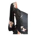 Allie Rose NWT- Beautiful black top with pink flowers, smocked back, 3/4 sleeves, ruffle bottom, brand new, size medium  Measurements: Bust: armpit to armpit 17-20 inches  Waist: side to side 14-16 inches  Length: shoulder seam to bottom 33 inches Photo 3