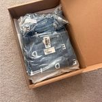 AYR  The Bomb Pop blue denim high-rise straight-leg jeans with a raw hem. Photo 1