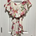 Francesca's Off the shoulder floral ruffled hem romper Photo 1