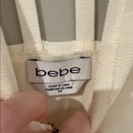 Bebe  vintage bandage dress in cream color with strappy details and gold hardware Photo 4