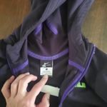 Nike  dri fit deep plum zip up size small women's.  Green details Photo 3