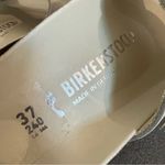 Birkenstock  Madrid Iridescent Big
Buckle Nubuck Leather Slide Sandal, Ecru,37EU Photo 10