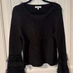 Milly  black long sleeve top with feathered sleeves Photo 0
