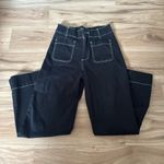 High waist black jeans with pockets both in the front and back. Only worn once. Size 2. I’m 5 ft and normally wear size XS Photo 2